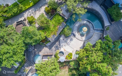 Families enjoying the expansive open-air thermal spa facilities