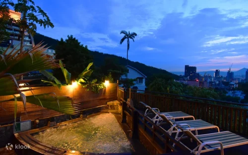 Stunning night view of the illuminated outdoor hot spring pools