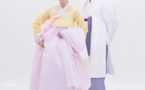 Family enjoying a cultural photoshoot wearing matching traditional Korean garments