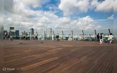 Visitors enjoying the sunset view from the Marina Bay Sands observation deck