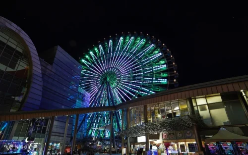 Couples enjoying a romantic evening ride on the Miramar Ferris Wheel in Taipei.