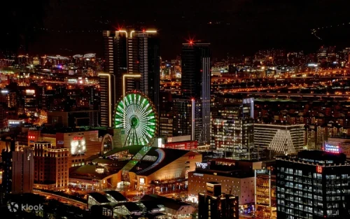 Dazzling neon light show illuminating the Taipei night sky from the giant Ferris wheel.