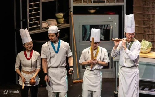 High-energy acrobatics and martial arts performance in a kitchen setting