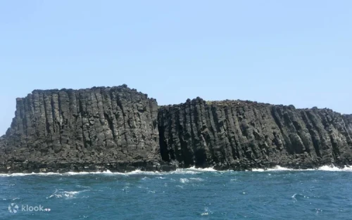 Tourists enjoying the scenic coastal view from Dongji Bagua Mountain