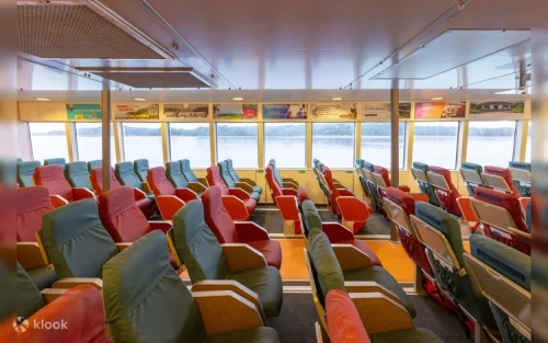 Luxurious Emerald Class seats with complimentary drinks for a premium journey