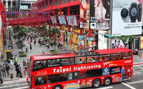 Beautiful night view of Taipei streets from the double decker bus