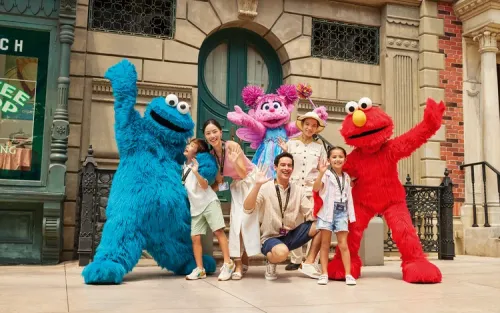 Family meeting Sesame Street characters at the theme park