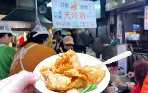 Vibrant food stalls and delicious local snacks at Keelung Miaokou Night Market