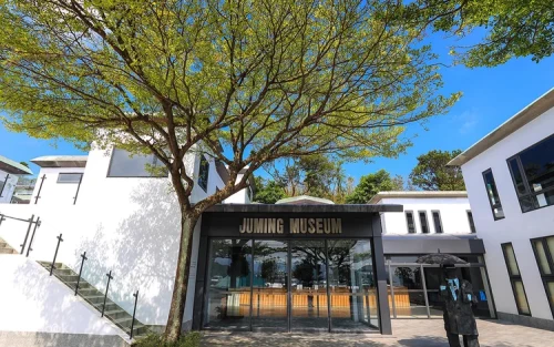 Families exploring the expansive outdoor exhibition at Ju Ming Museum