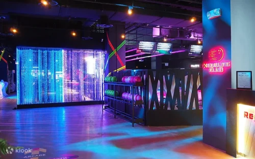 Group of friends playing arcade games and darts