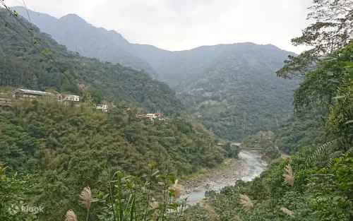 The stunning three-tiered Neidong Waterfall cascading down lush green cliffs