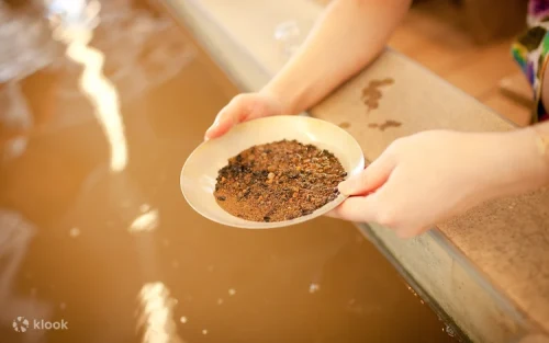 Visitors experiencing traditional gold panning at Jinguashi