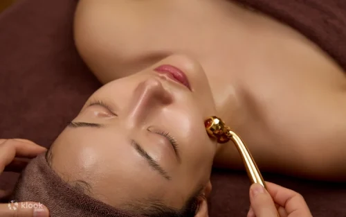 Professional beauty therapist performing a soothing scalp massage