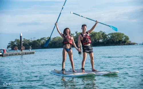 Friends having fun on a thrilling banana boat ride in Singapore