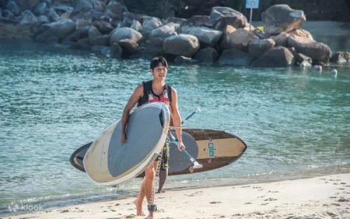 Couple kayaking together along the beautiful Sentosa coastline