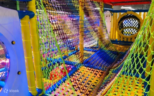 Kids playing in the colorful interactive ball pit