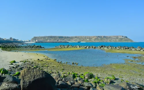 Magnificent basalt rock formations towering over the sea on Tongpan Island