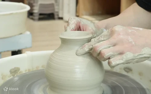 Beautiful handmade ceramic cups and bowls displayed in a studio