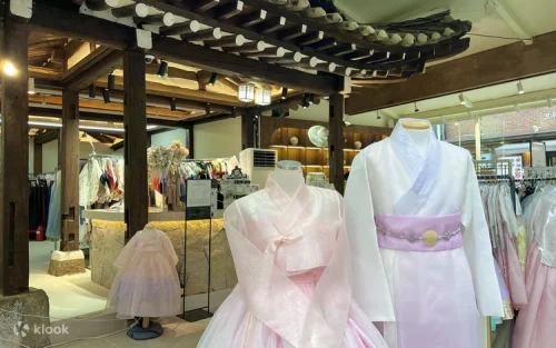 Professional indoor Hanbok photoshoot featuring elegant traditional Korean dresses
