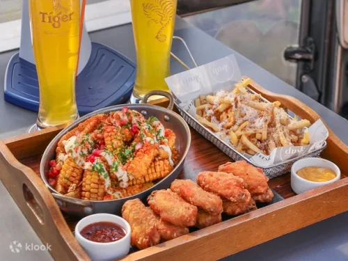 Traditional Heritage Peranakan Tingkat meal with a skyline view