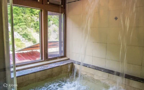 Tranquil private hot spring room for two overlooking the beautiful Nanshi River.