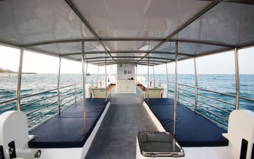 Passengers enjoying the stunning coastal scenery from the upper deck of the Xiaoliuqiu semi-submarine.