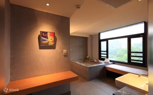 Private bathhouse suite with a scenic window view of the natural river