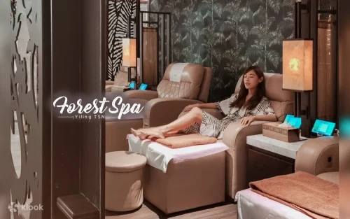 Professional therapist performing a soothing hot stone treatment