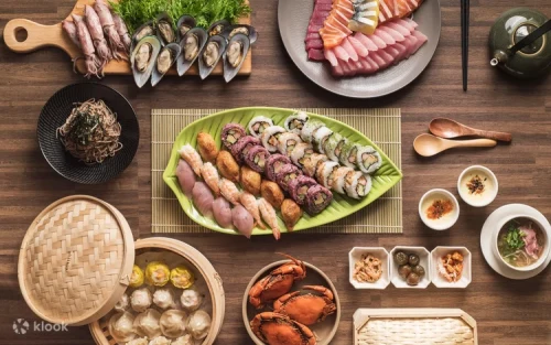 Chefs preparing international cuisine at live cooking stations