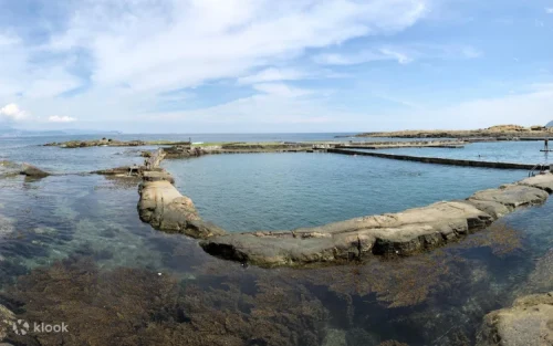 Swimming in the blue seawater pool at Heping Island