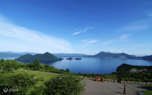 Serene crystal-clear waters of Lake Toya viewed from the SAIRO Observatory
