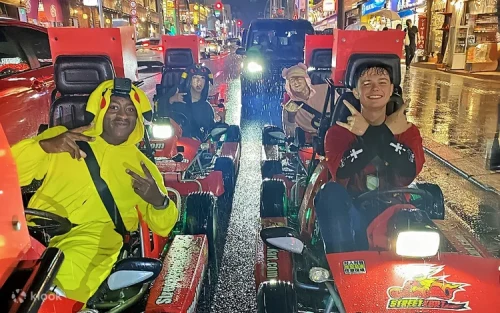 Driving a custom go-kart down the vibrant Kokusai Street in Naha
