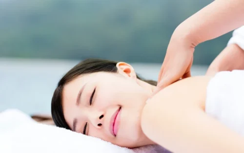 Professional therapist performing traditional foot reflexology