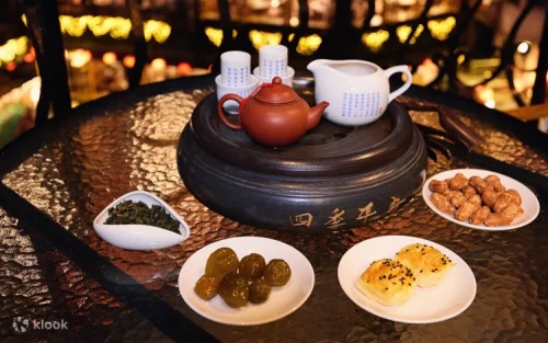 Visitors relaxing on the open-air terrace overlooking the Jiufen mountains