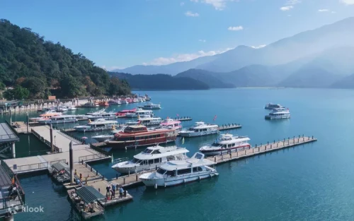 Comfortable compact car driving along the scenic mountain roads of Nantou