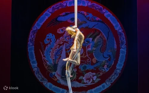 Performers in vibrant costumes performing traditional Peking opera in Taipei.