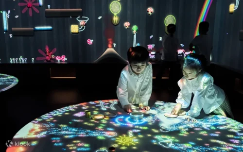 Children interacting with the colorful Sketch Aquarium Connected World