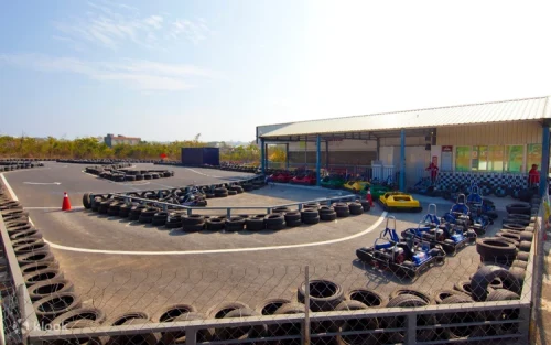 Family enjoying a ride together in a two-seater go-kart