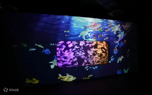 Children interacting with the Light and Shadow Ocean Window Projection