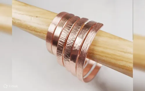 Various textured copper and silver bracelets including water ripple and tree bark styles