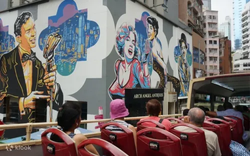 Passengers listening to the multi-lingual audio commentary on a city tour