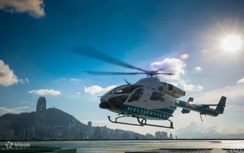 Helicopter soaring above the iconic Victoria Harbour skyline
