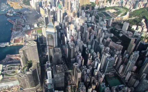 Luxurious MD902 Explorer helicopter flying over Hong Kong