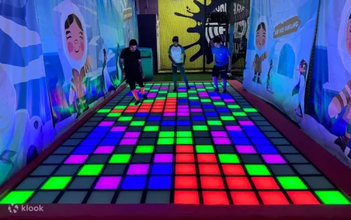 Teenager scaling the indoor rock climbing wall