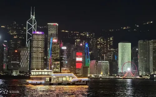 Cruising past the Central Ferris Wheel and Hong Kong skyline