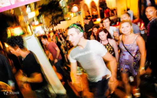 Travelers and expats enjoying welcome shots at a vibrant Hong Kong bar