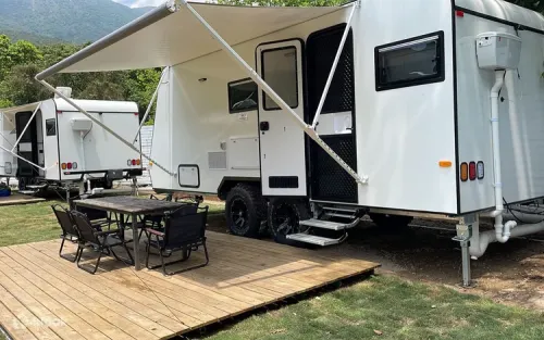 Evening beachfront barbecue setup under the stars