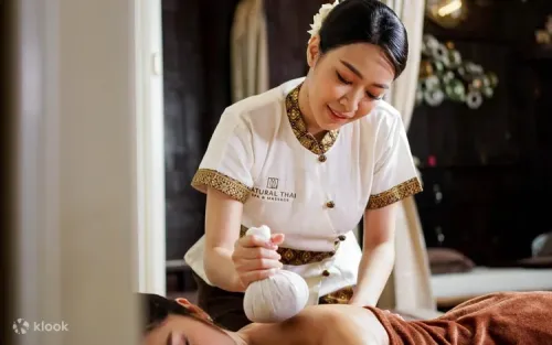 Aromatic essential oils and fresh herbs used in spa treatments
