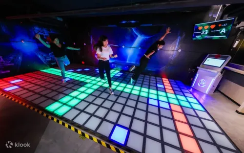 Friends competing in classic arcade games like air hockey and basketball