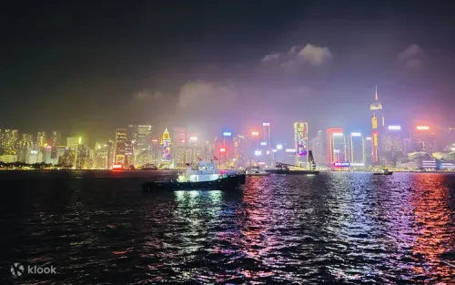 Illuminated Hong Kong skyline viewed from a 70-foot luxury cruiser